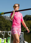 Woman in JL Pink top and Pink JL Trou with pigs that have wings and oars