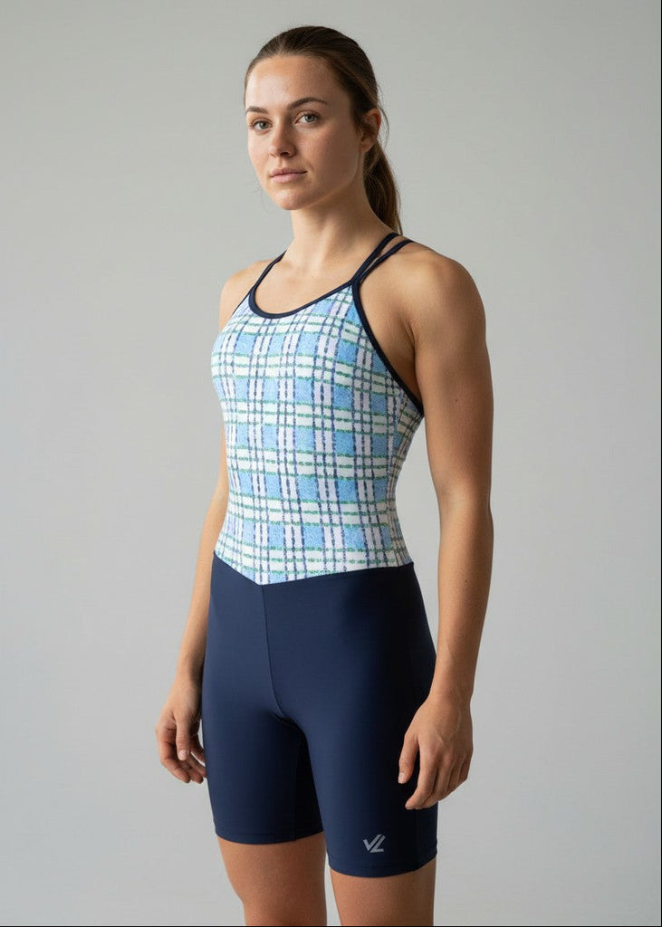 Woman wearing a blue and white checkered athletic uni 