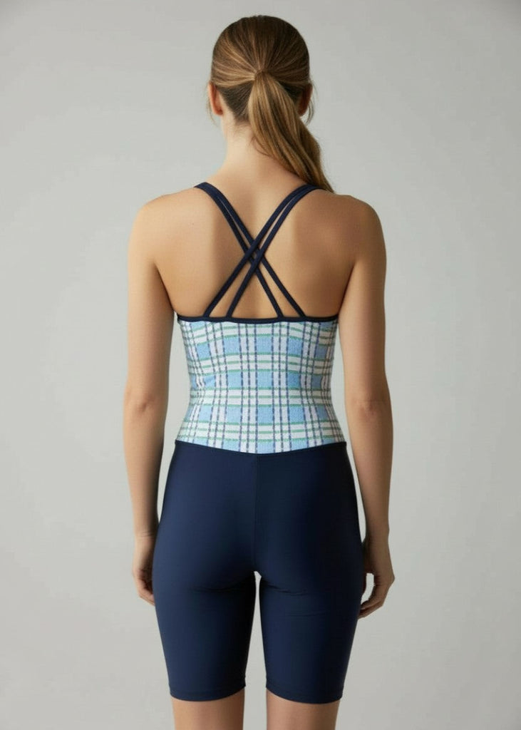 woman wearing blue row unisuit strappy back